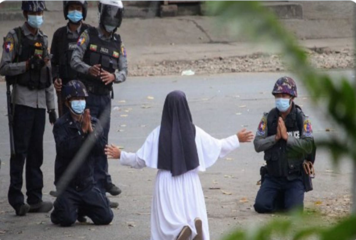 Military coup in Myanmar protests continued a nun gets to her knees to beg armed officers to shoot her instead of protestors