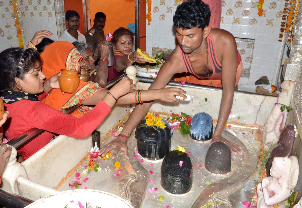 water,temple,Ramghat started to glow with the light of lamps,milk,god trust