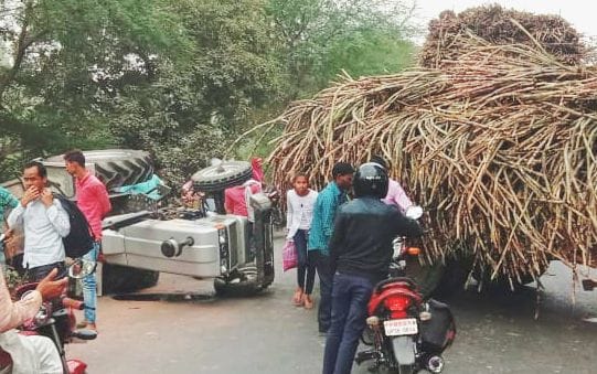 Two tractor trolleys collided, one overturned