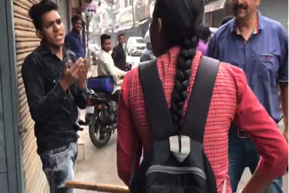 A girls students have beaten up to two youths in sadar market of Meerut and see photos