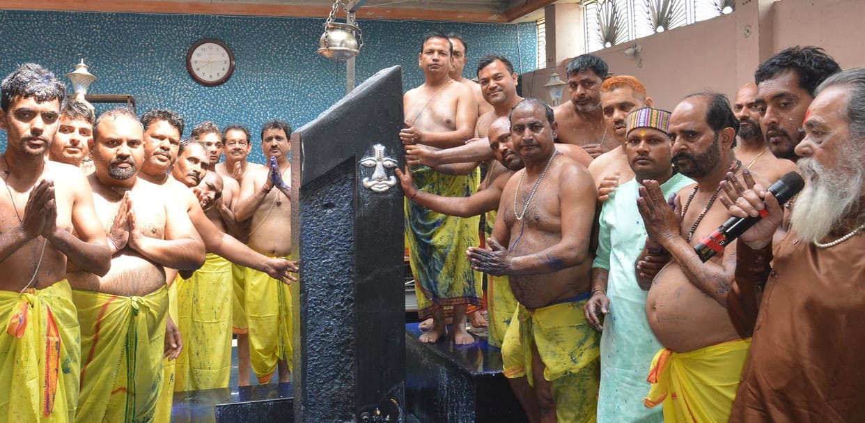 Abhishek done to Panchamrit of Shani Dev