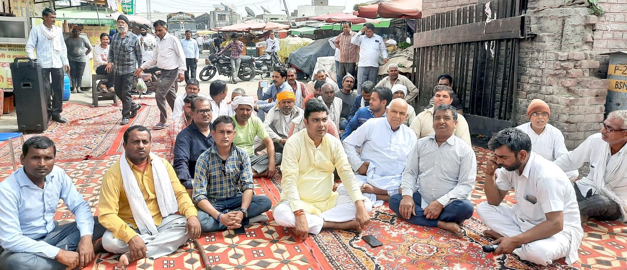 When asked to remove the hawker from the vegetable market, the protest was done by locking the gate.