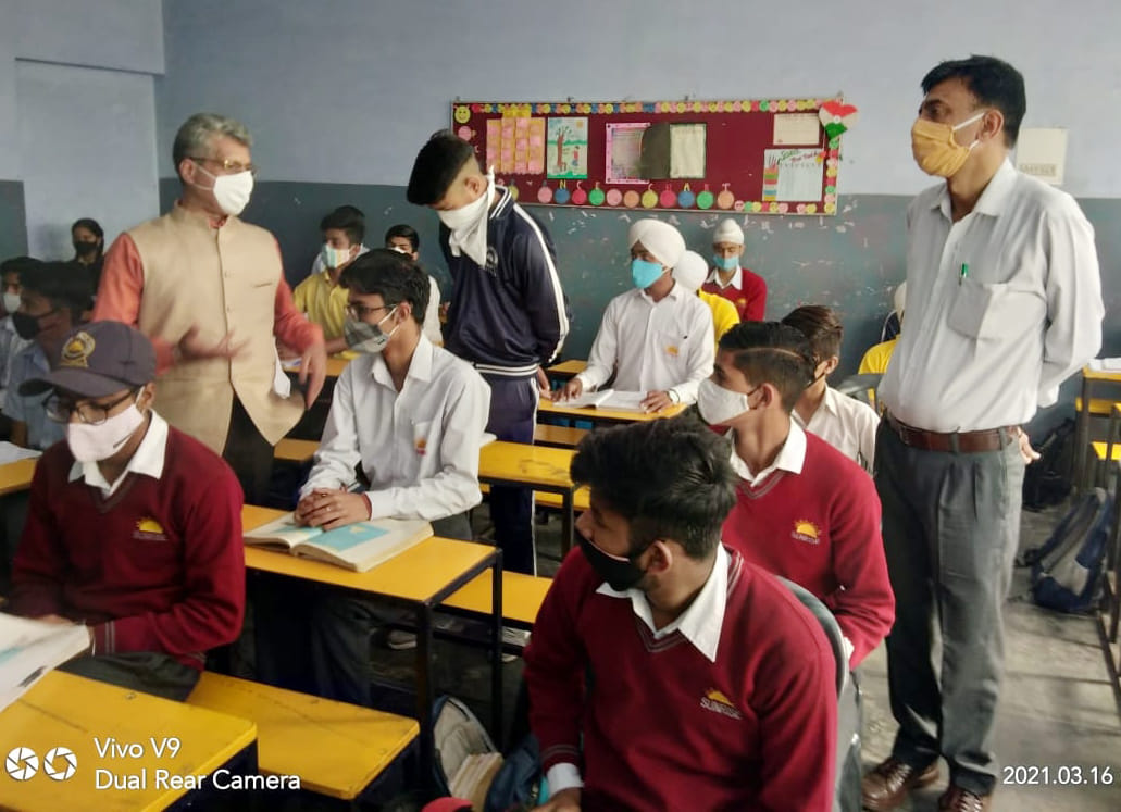 To the student and teacher without seeing the mask