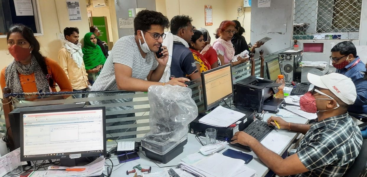 Crowd of customers in banks, long queues in front of ATMs