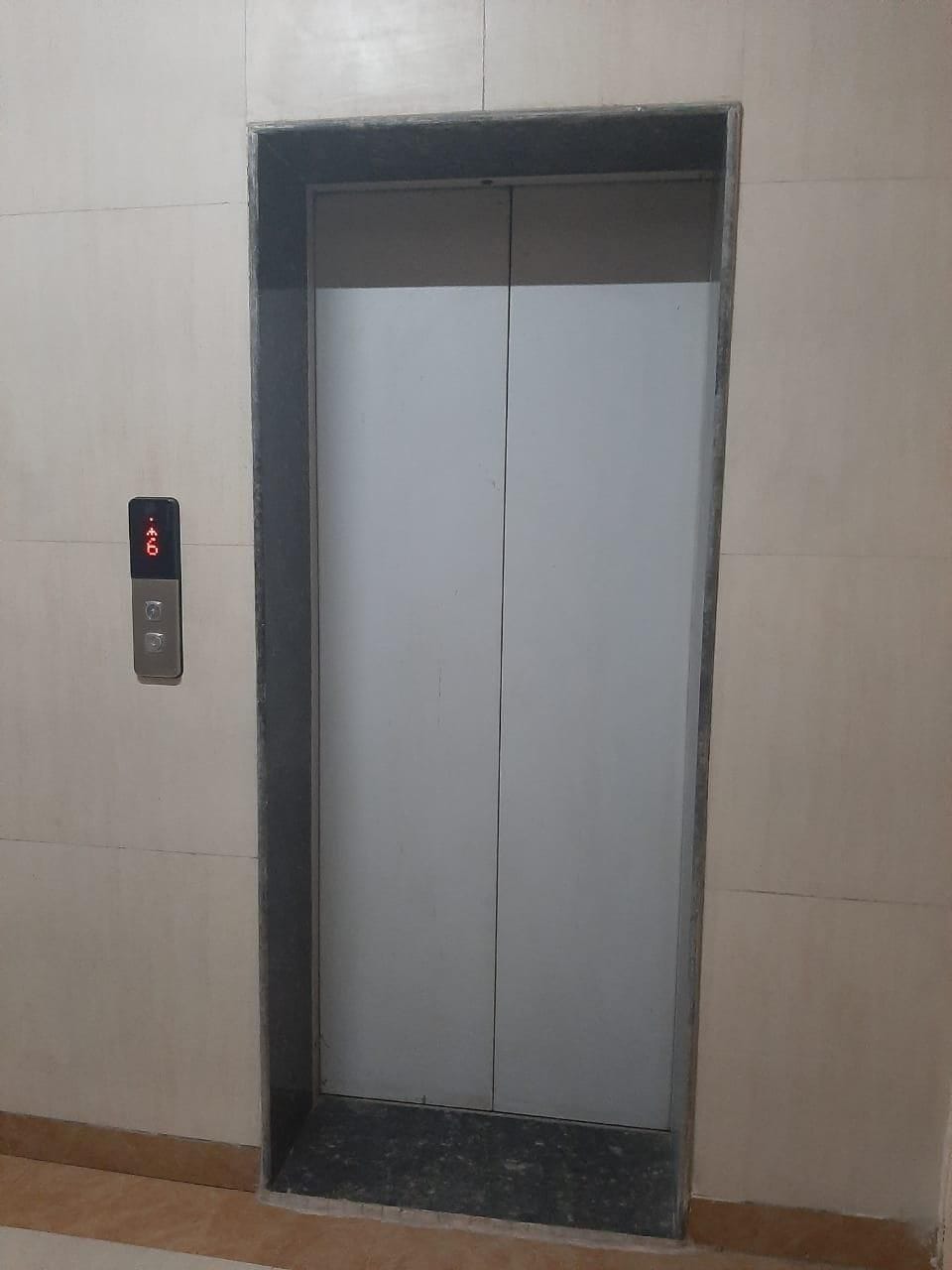 Elderly woman stuck in lift with son for 20 minutes