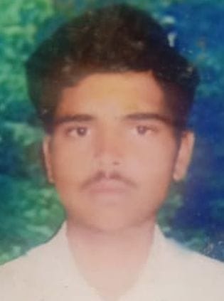 The body of a dairy worker was found hanging from a tree.