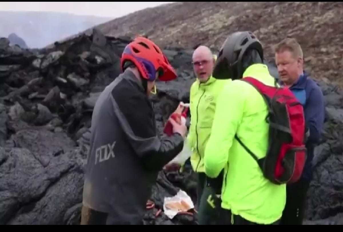scientist cooked hotdog on the lava of iceland volcano