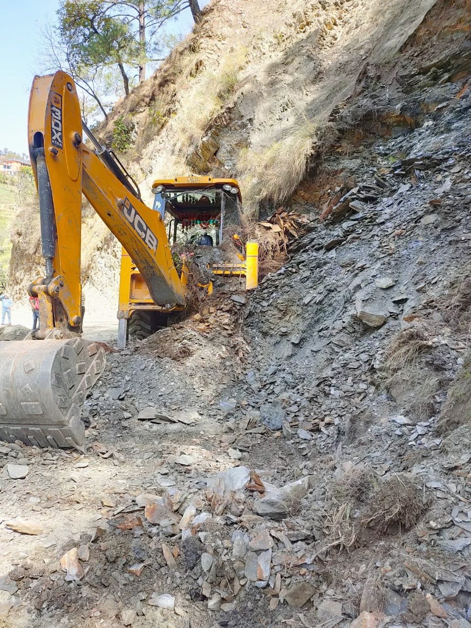 Debris fell on JCB, driver saved life by jumping