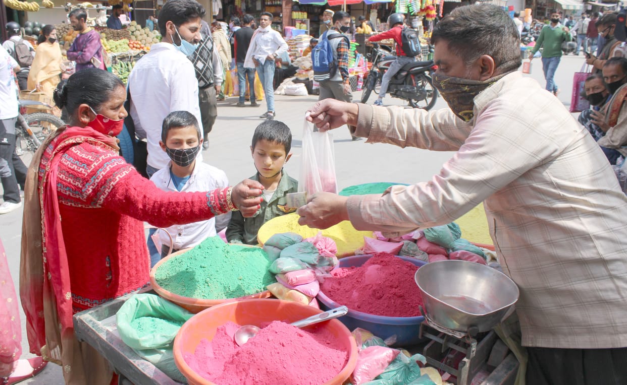 People gathered in preparation for Holi amidst restrictions