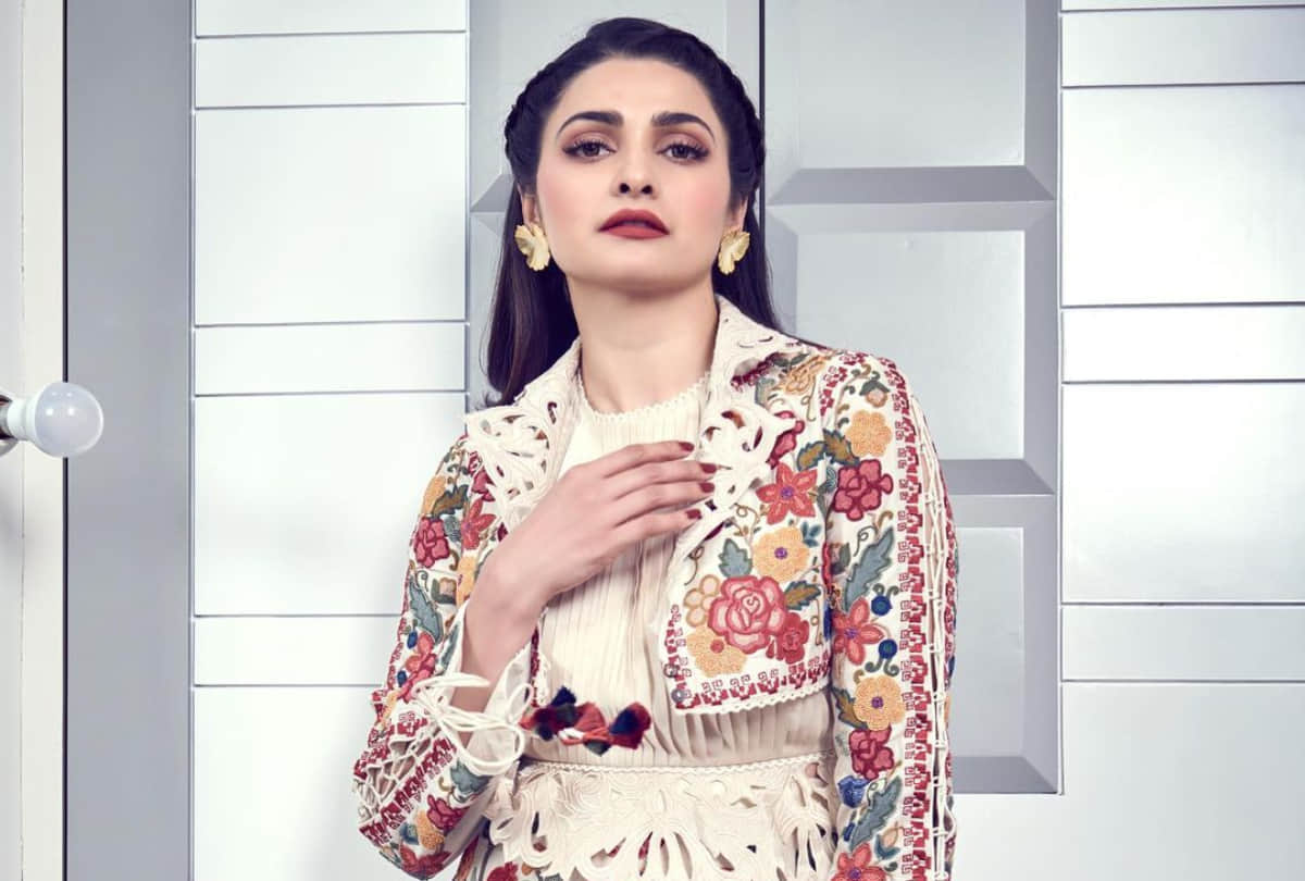 prachi desai wear ivory shade skirt with top diana penty mustard kaftan which look impressive