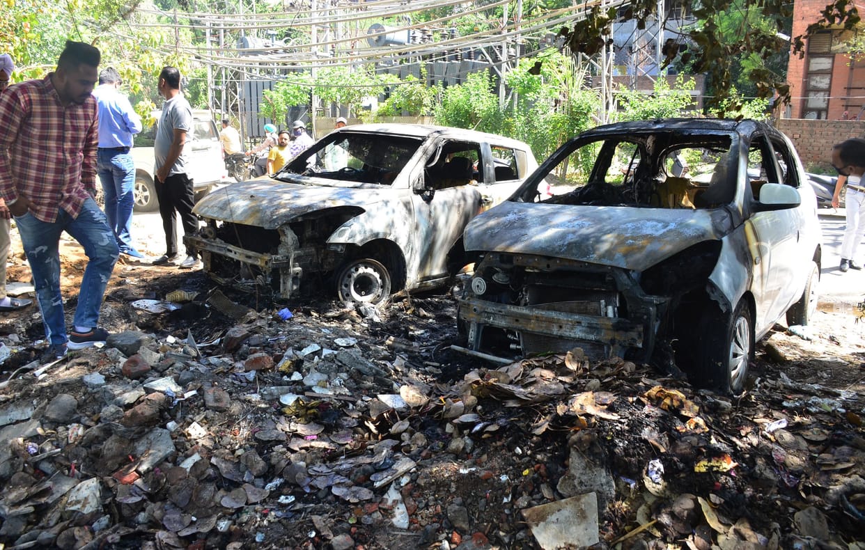 fire in garbage, two cars burn