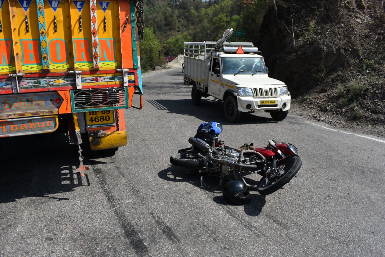 Truck collides with bike, father and son injured