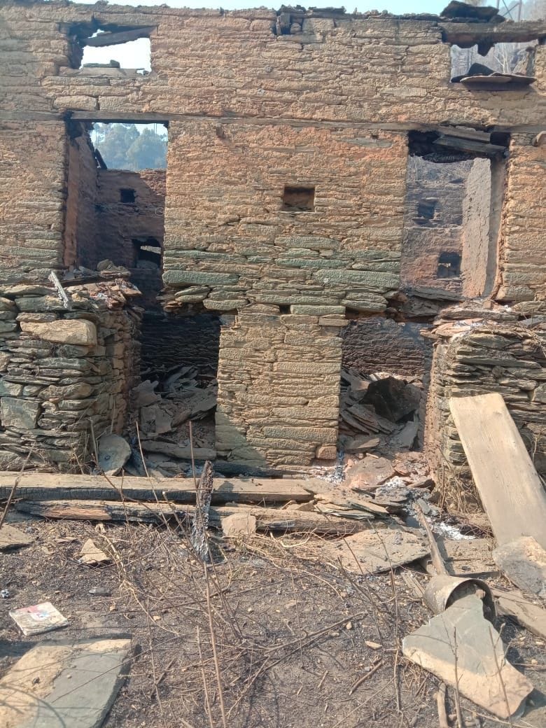 Old house was destroyed in a fire in the field beyond the fire