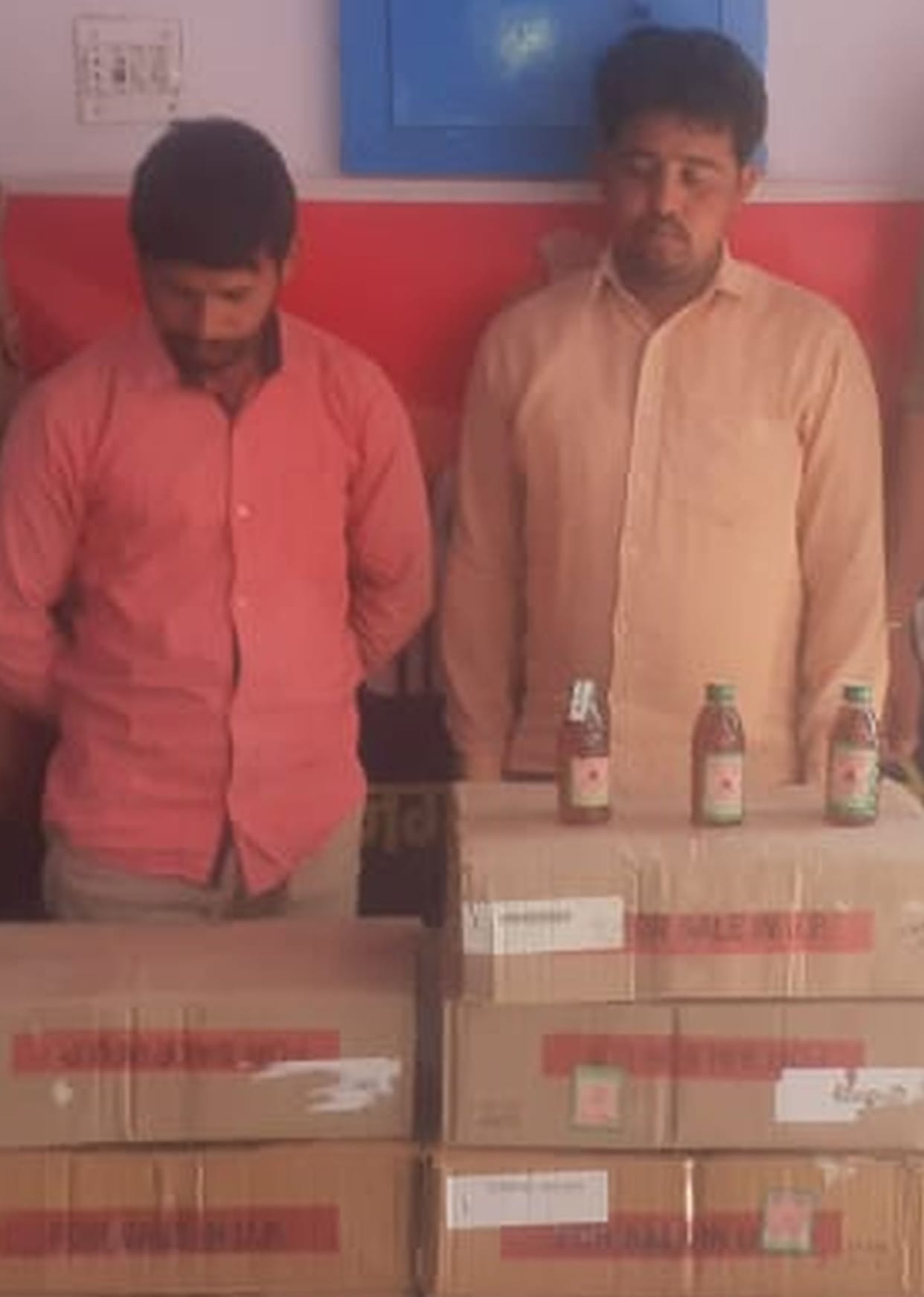 Two salesmen arrested with 16 cases of illegal liquor