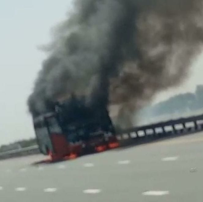 Fire on bus moving on expressway