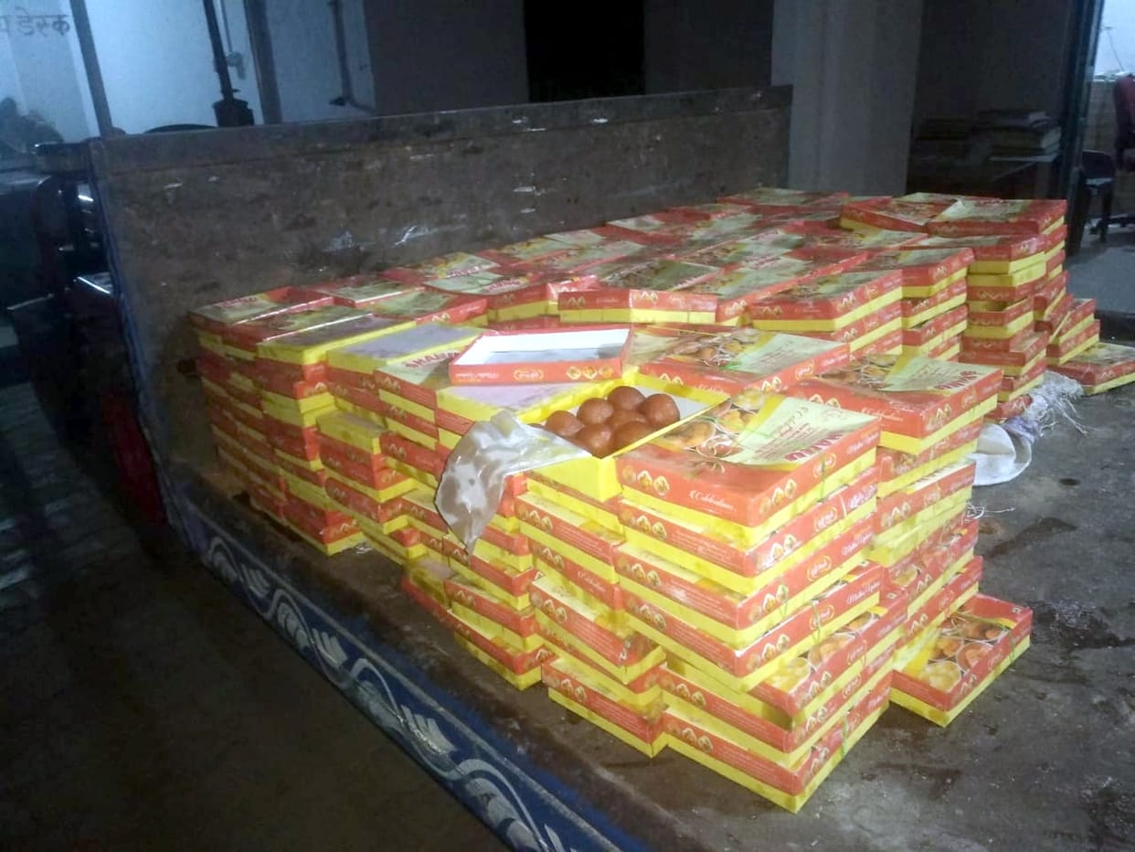 Holding 400 cans of rasgullas