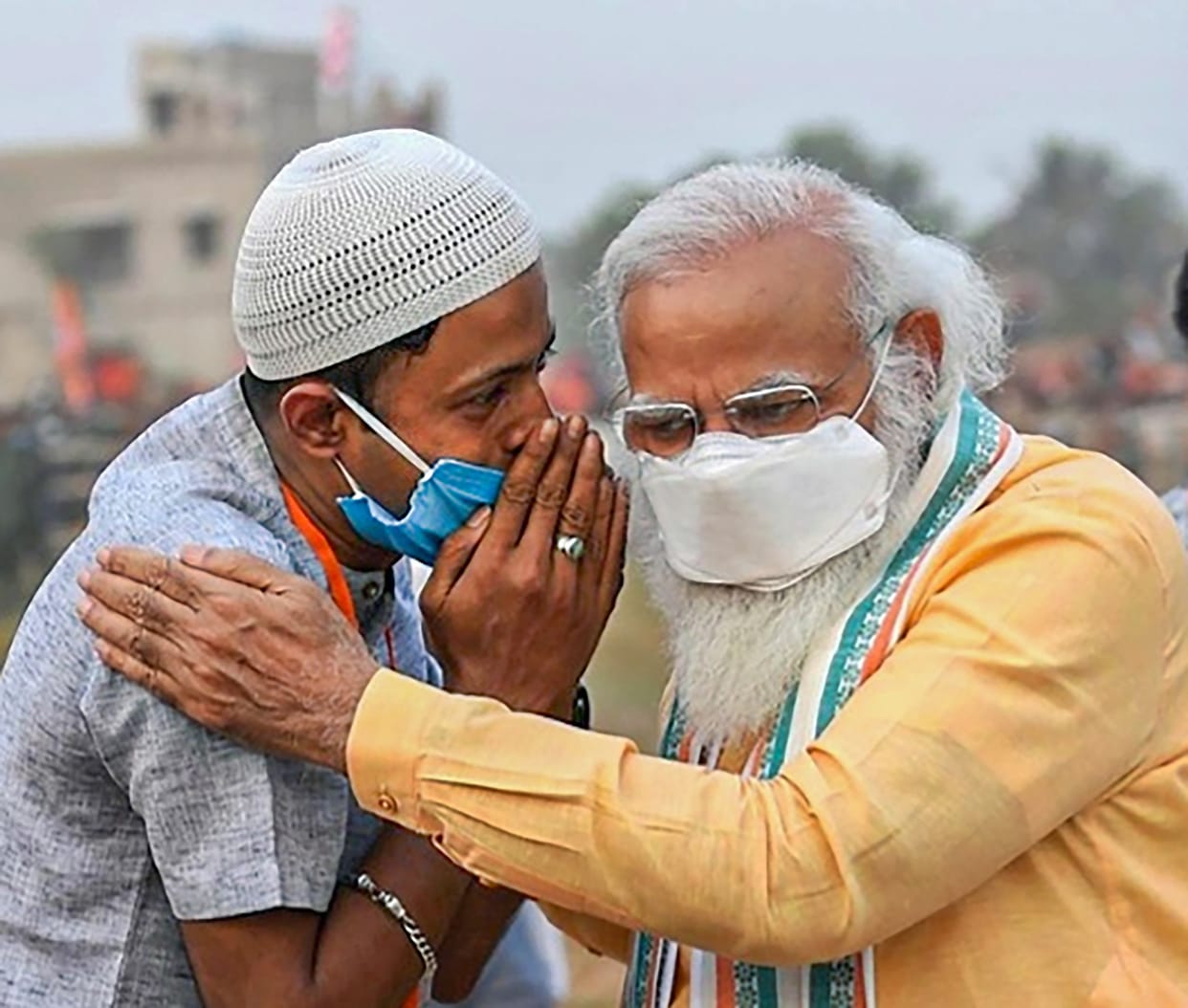 Prime Minister Narendra Modi with a supporter during an election rally in Hooghly district West Bengal
