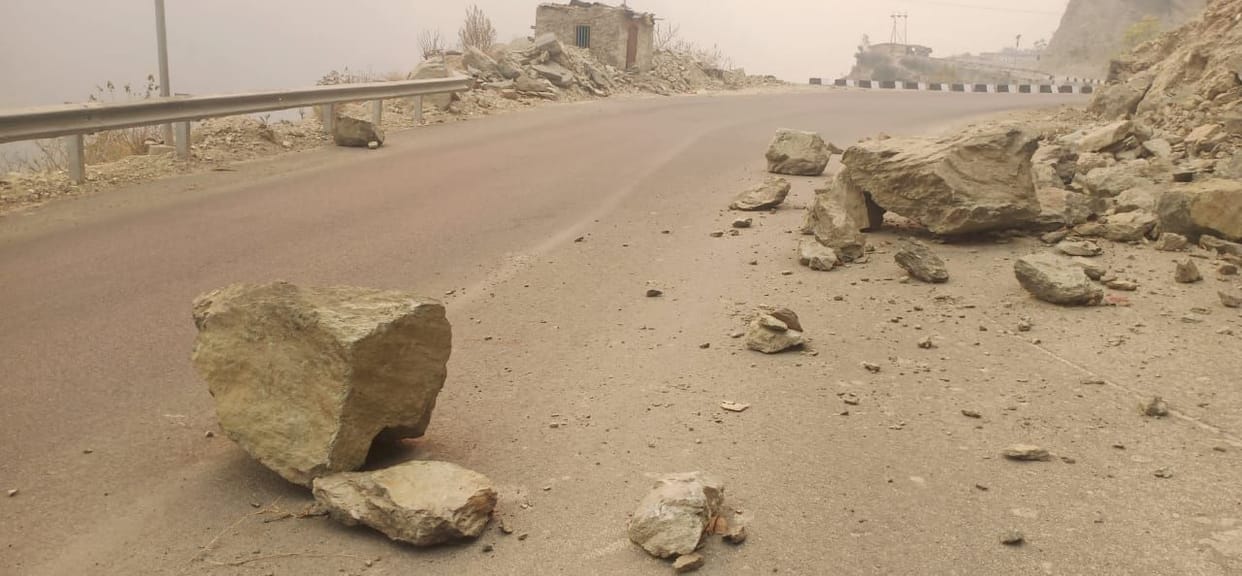 Stones hanging in danger on perennial road