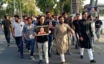 मार्च निकालते एएमयू छात्र नेता।