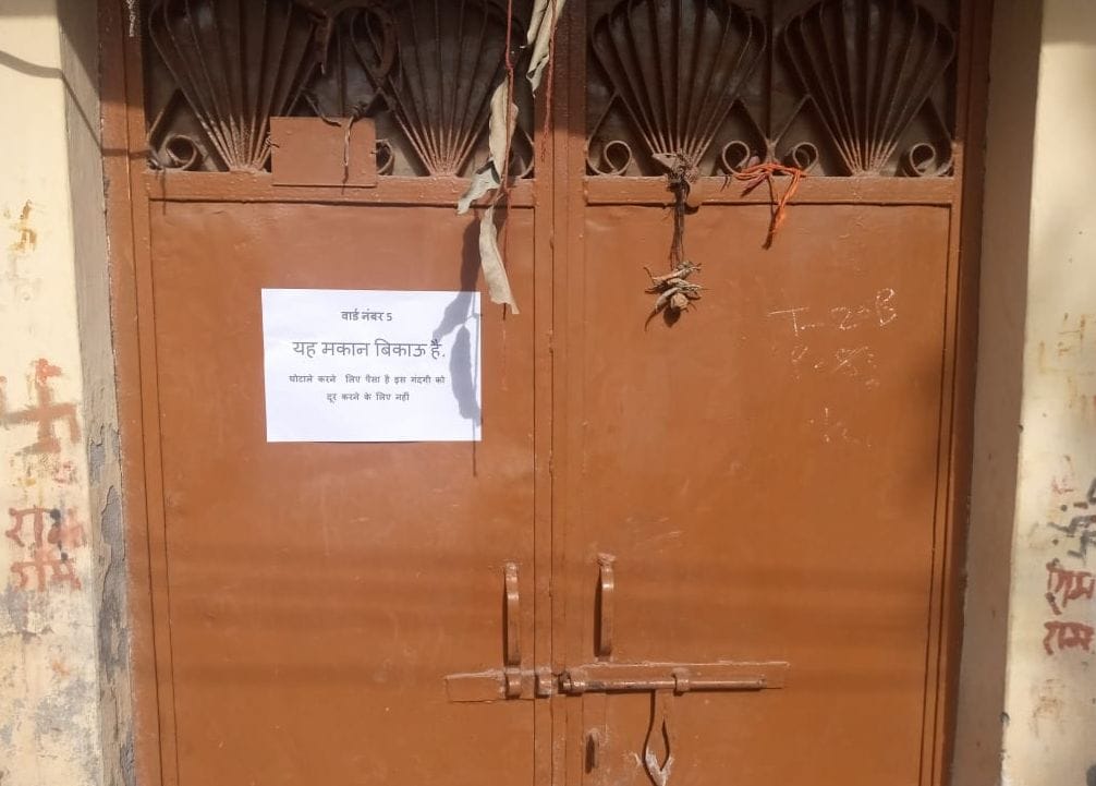 People upset by sewerage overflow put up posters to sell the house