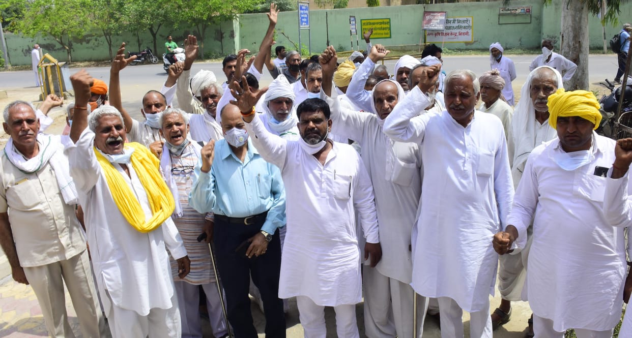people protest, electricity tower, field
