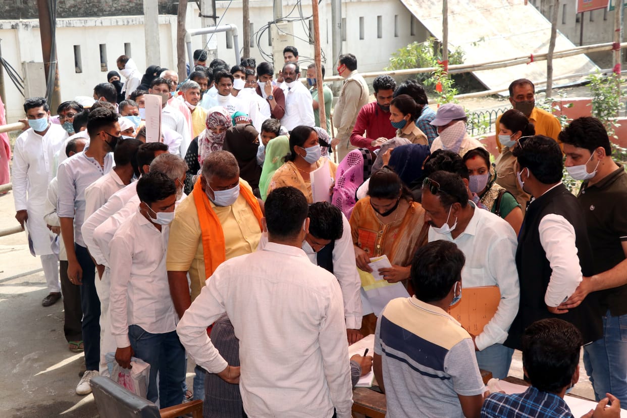 Crowd of claimants gathered at enrollment centers