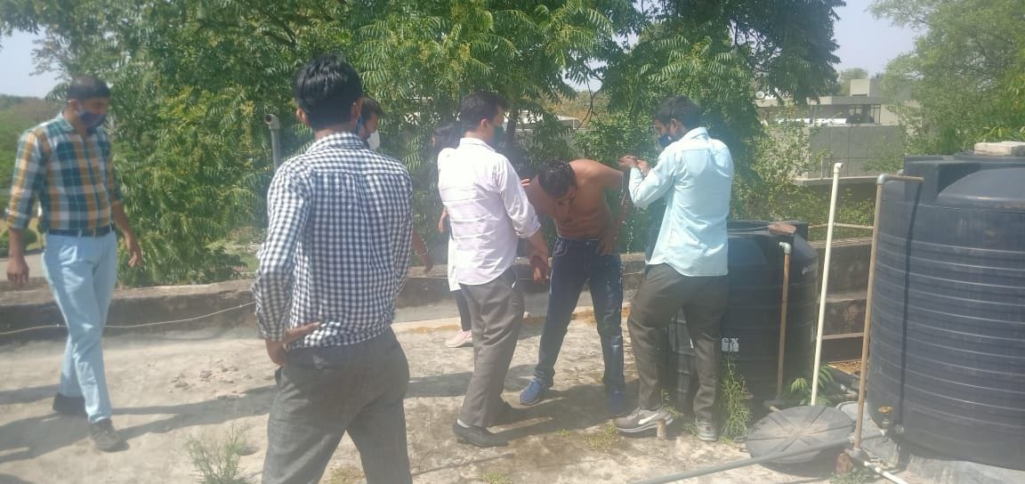 An employee upset by going to the roof job of DEO office was pouring petrol and self-immolation, other employee saved life by snatching lighters