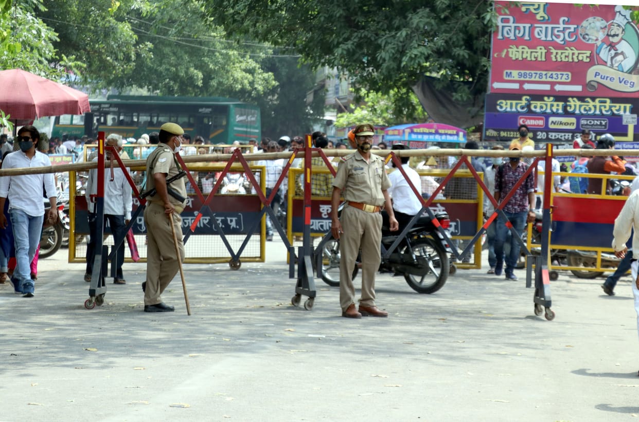 Police chased away the crowd standing outside the block
