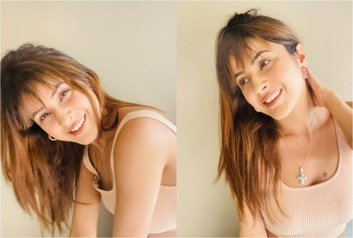 shehnaz gill flaunts new hair cut with bangs and toned abs