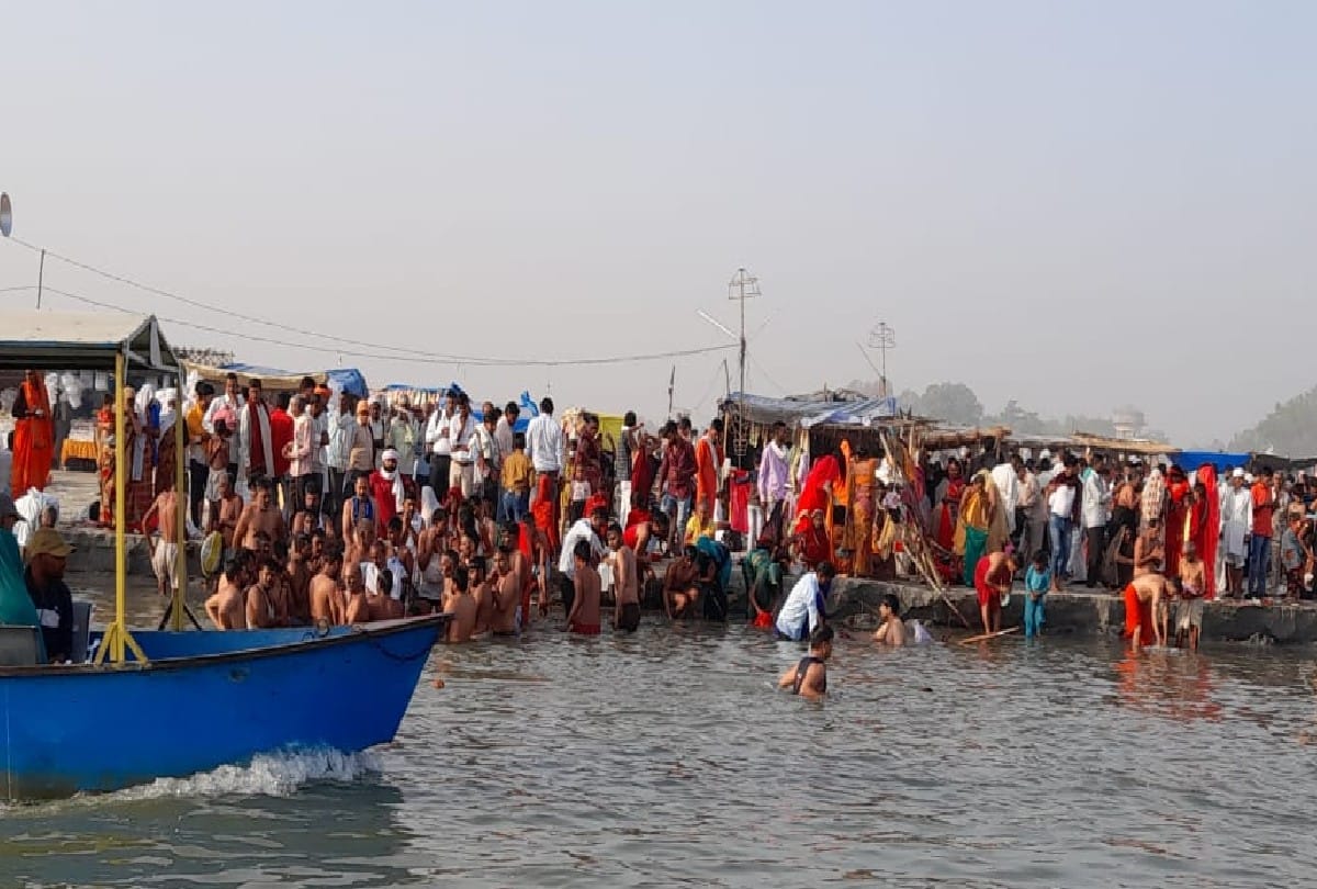 crowd of devotees gathering on ganga ghats for taking holy bath in kasganj