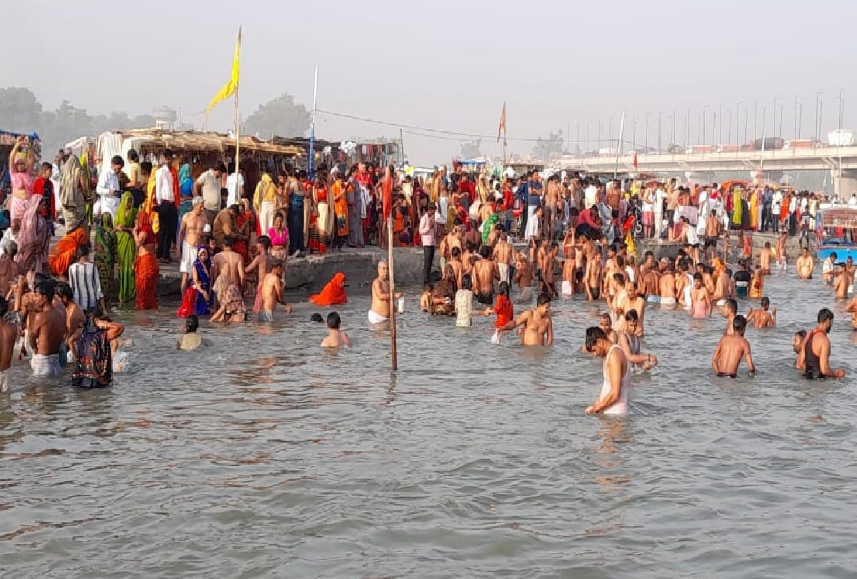 crowd of devotees gathering on ganga ghats for taking holy bath in kasganj