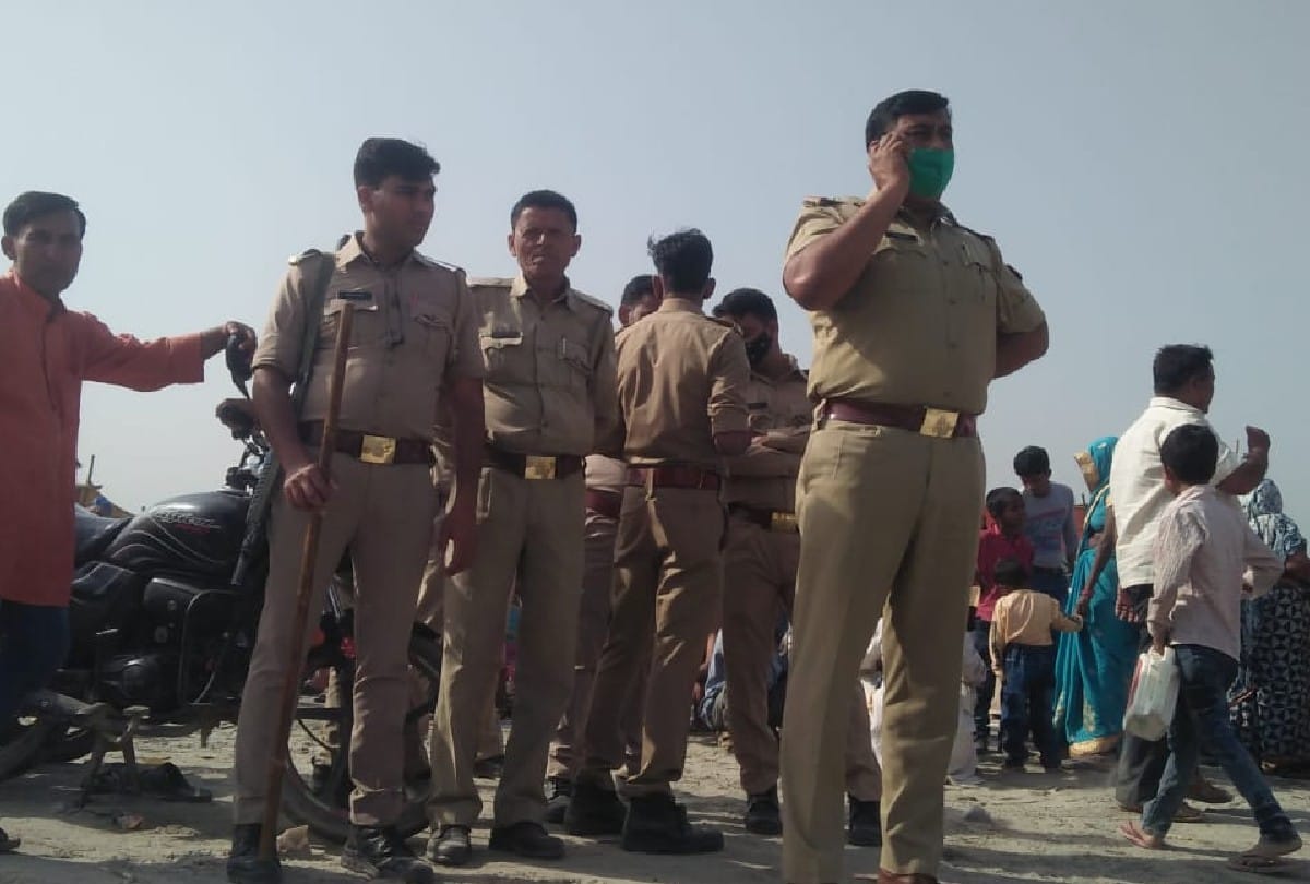 crowd of devotees gathering on ganga ghats for taking holy bath in kasganj