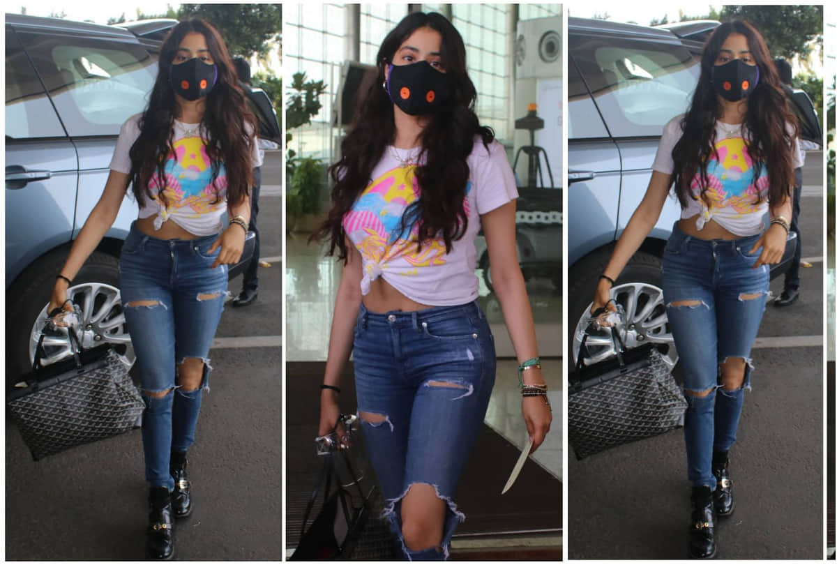 janhvi kapoor cool look turns in stylish at airport in white shirt with ripped jeans