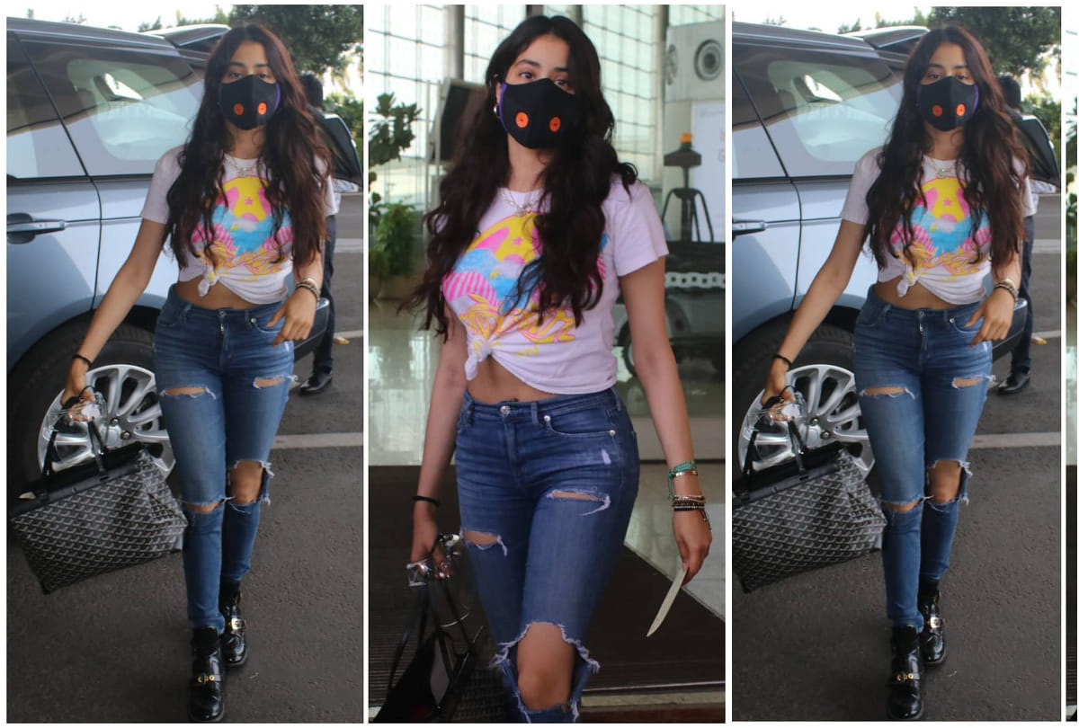 janhvi kapoor cool look turns in stylish at airport in white shirt with ripped jeans