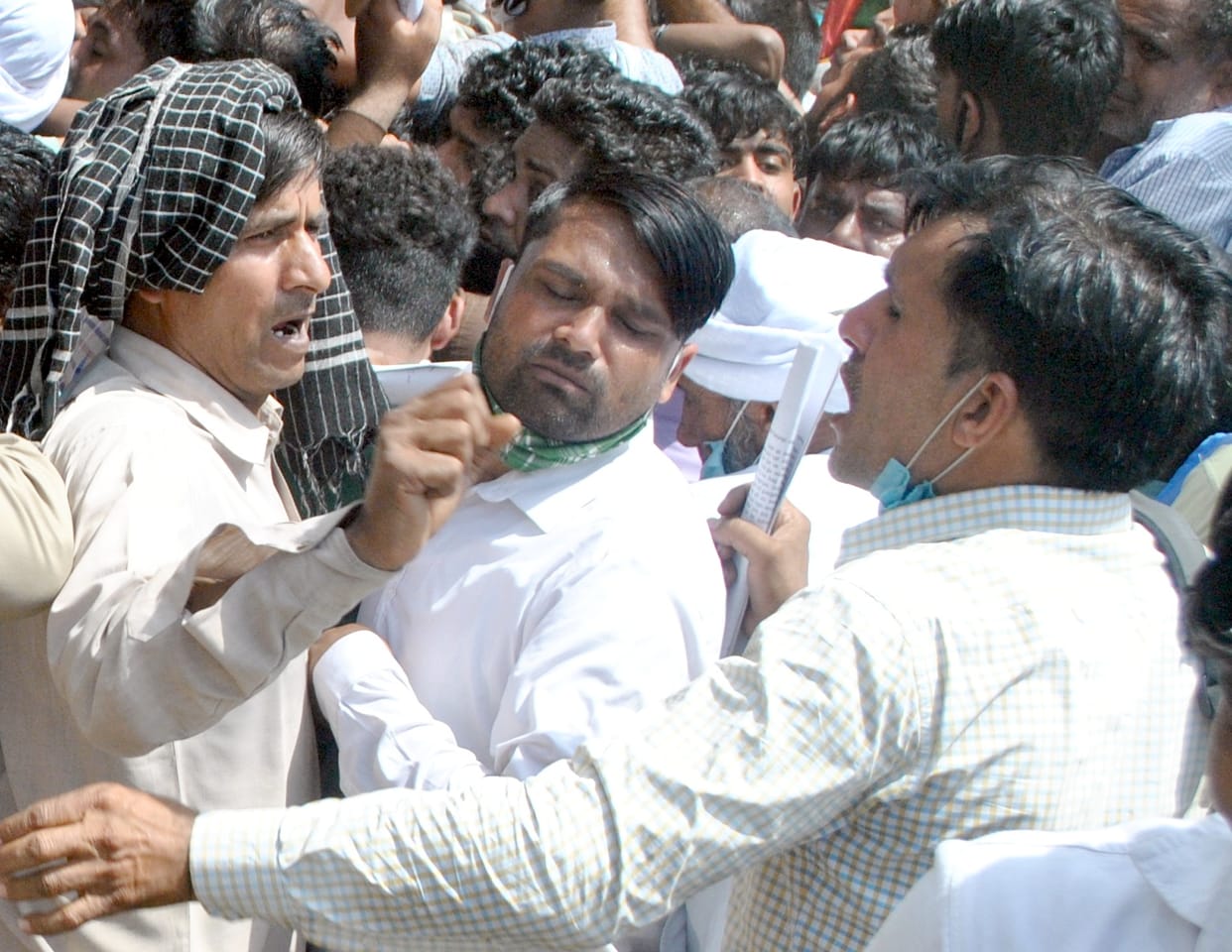 Crowds thronged the bank, not masking social distancing
