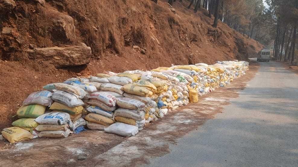 The road is covered with khadia sacks