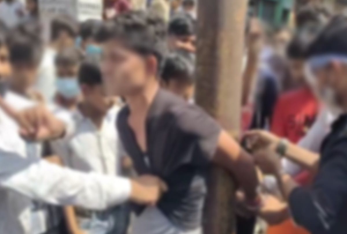 mob beat the molester after tied to electric pole