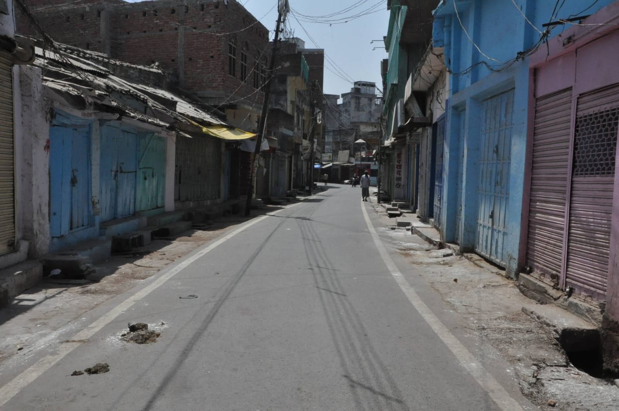 People living in houses, shops closed, silence on the streets