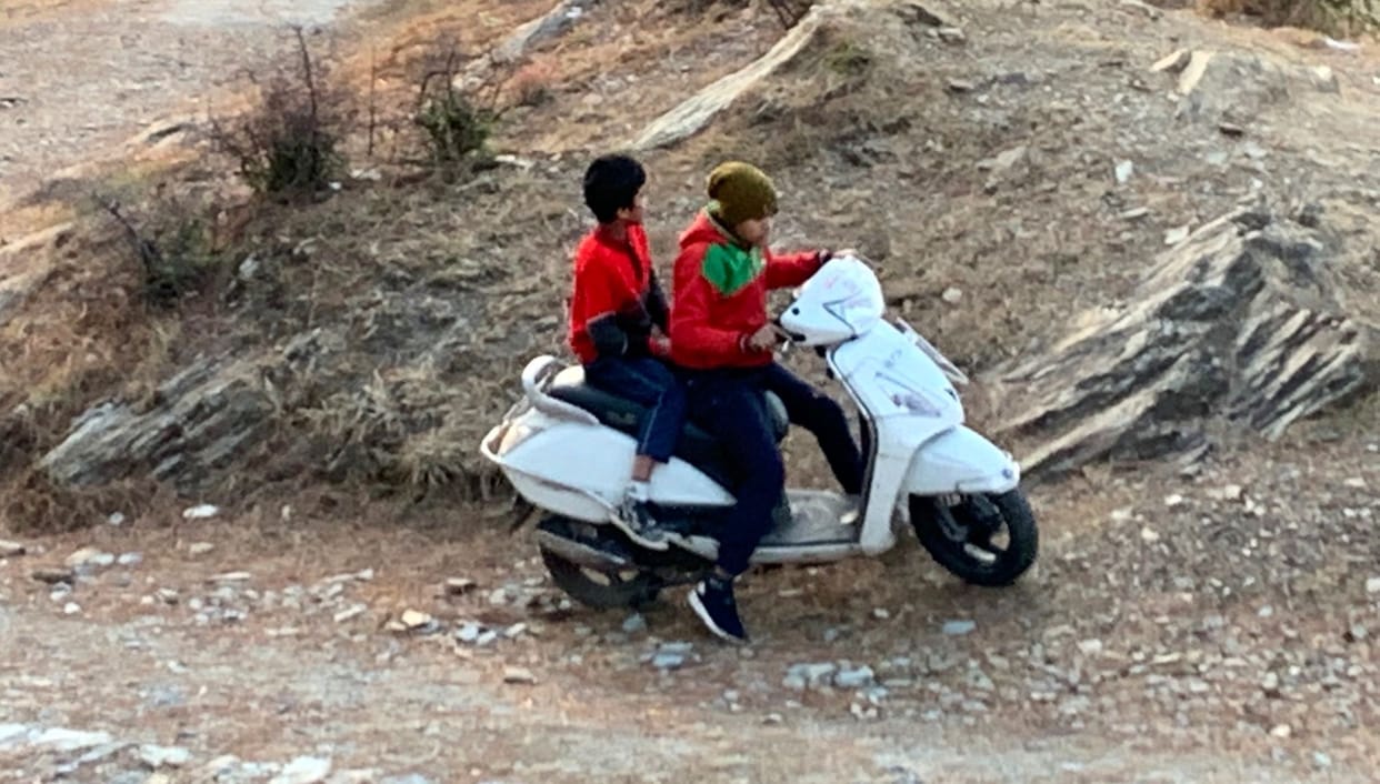 Minor scooters running on city streets