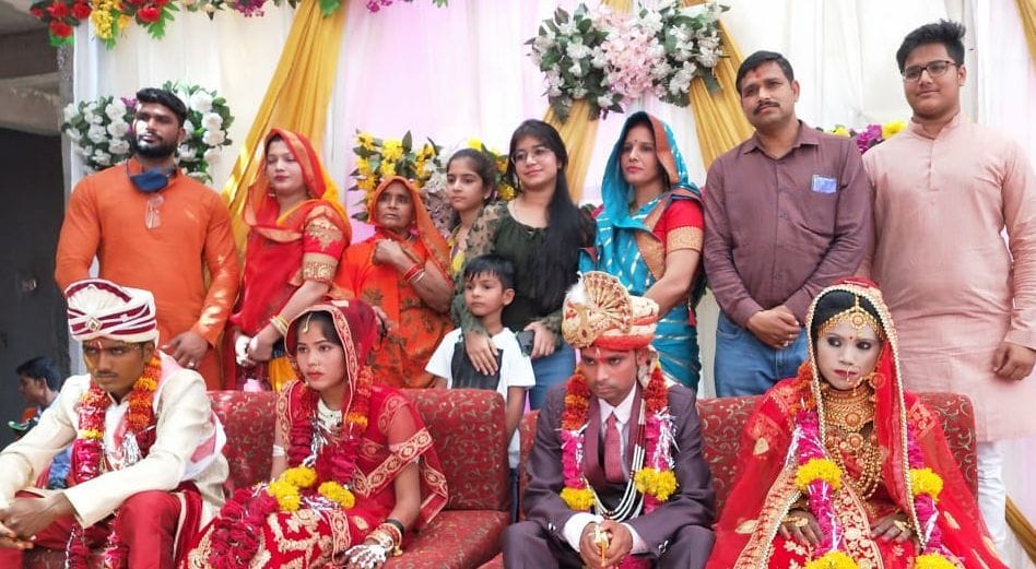 Two girls' hands yellow on Ramnavami