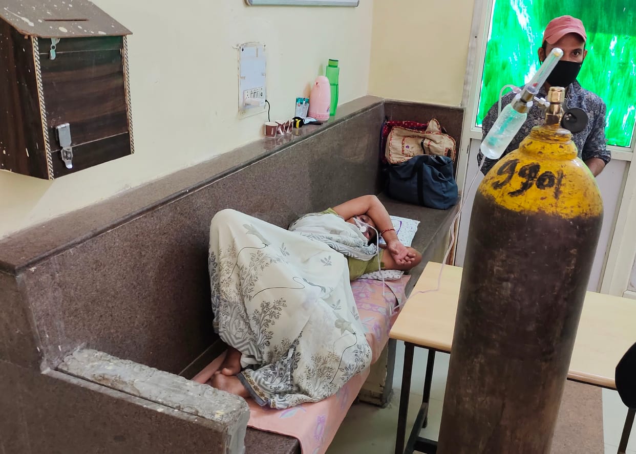 There is no bed, patients are sitting and getting oxygen