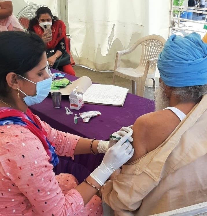 Agitating farmers got covid vaccine installed