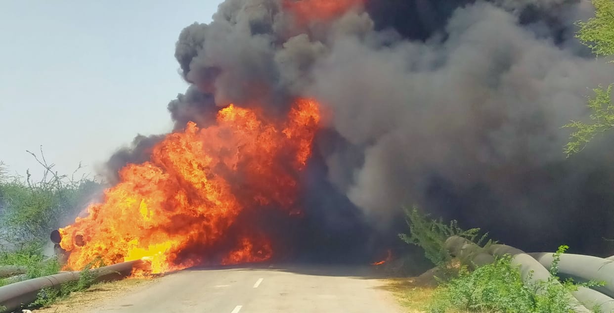More than 100 plastic pipes lying on the road burn