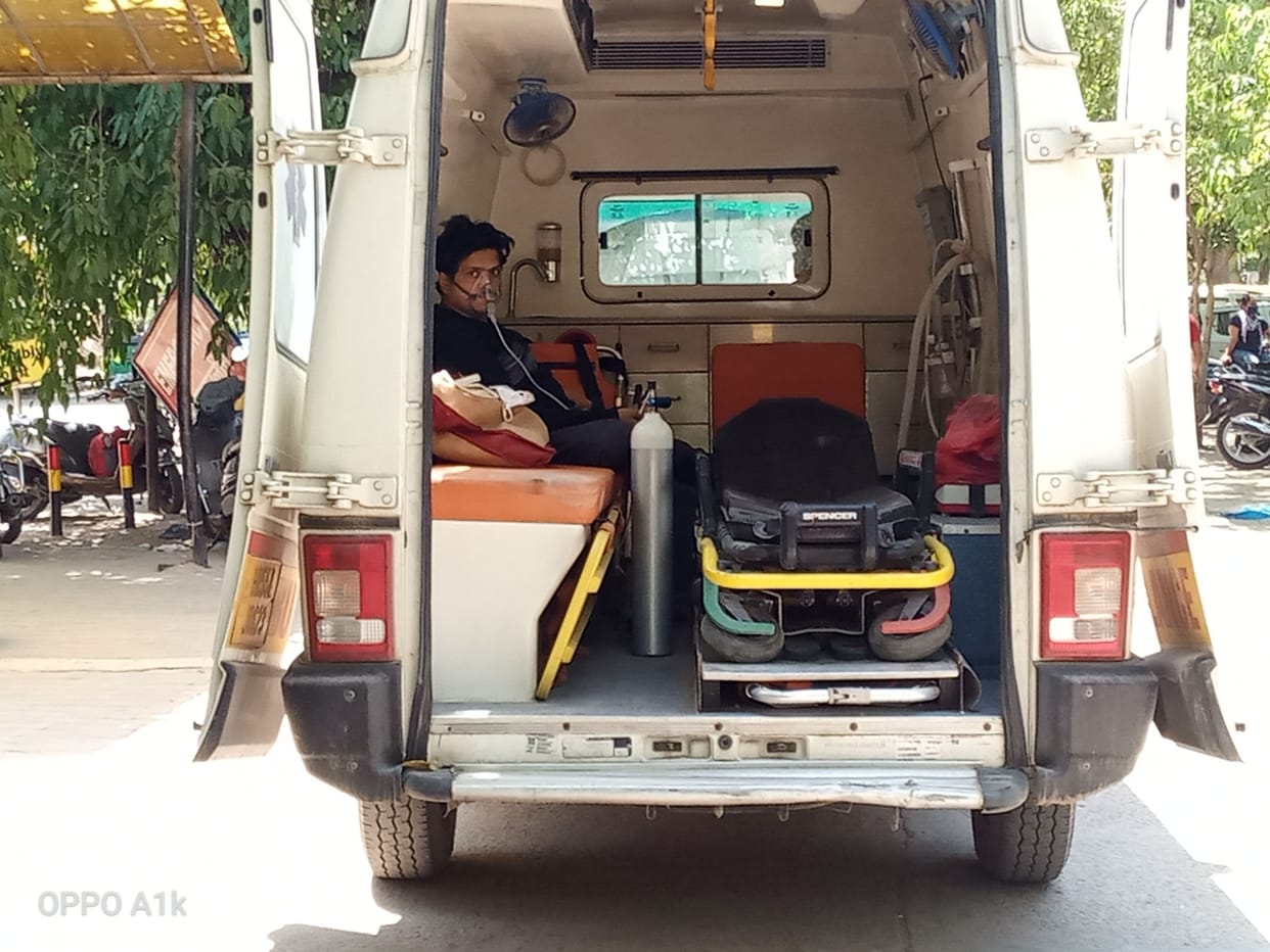 Patients suffering in ambulances outside the hospital
