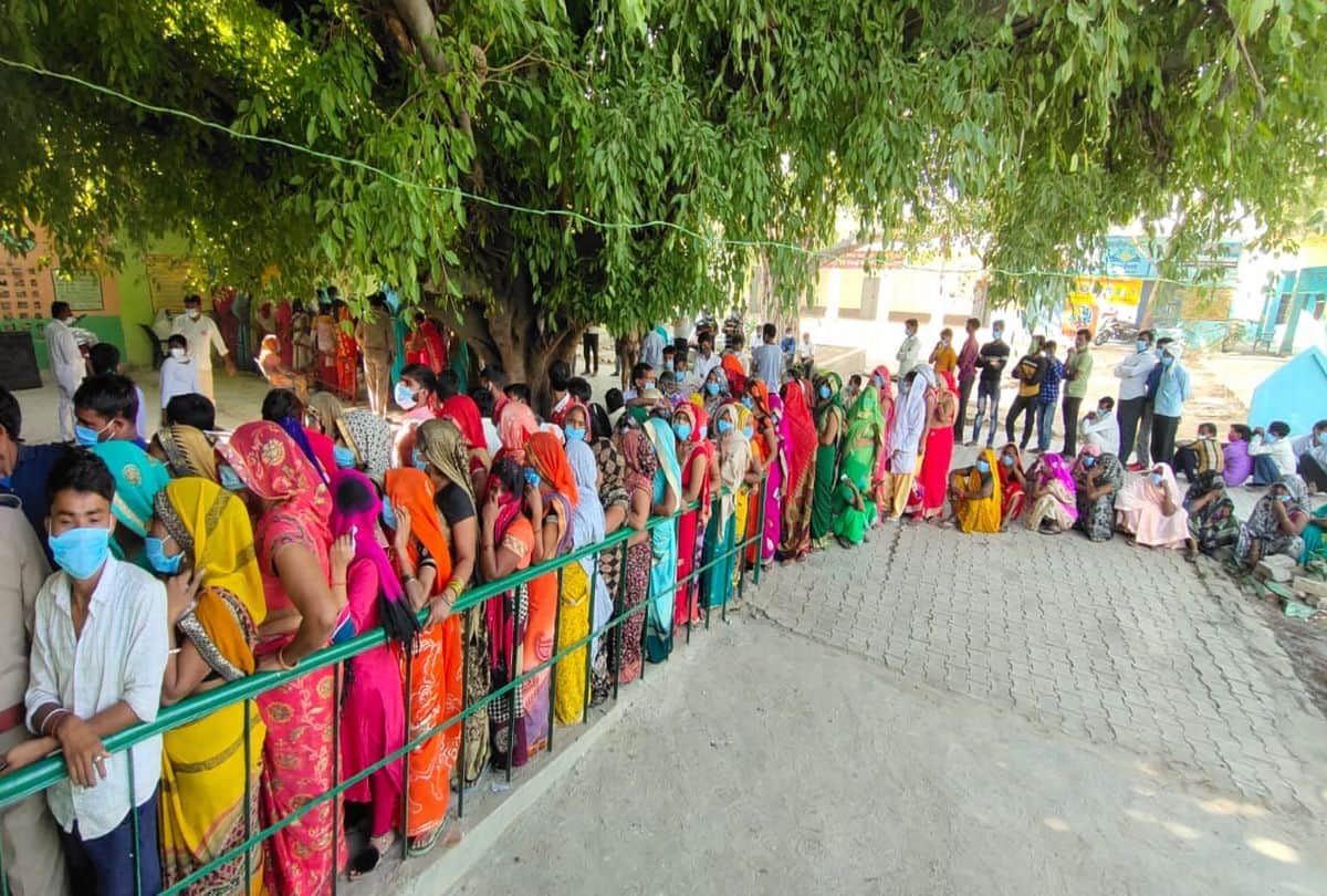 Voters queue outside polling booths as voting for panchayat elections is firozabad