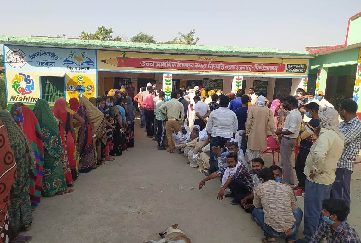 Voters queue outside polling booths as voting for panchayat elections is firozabad