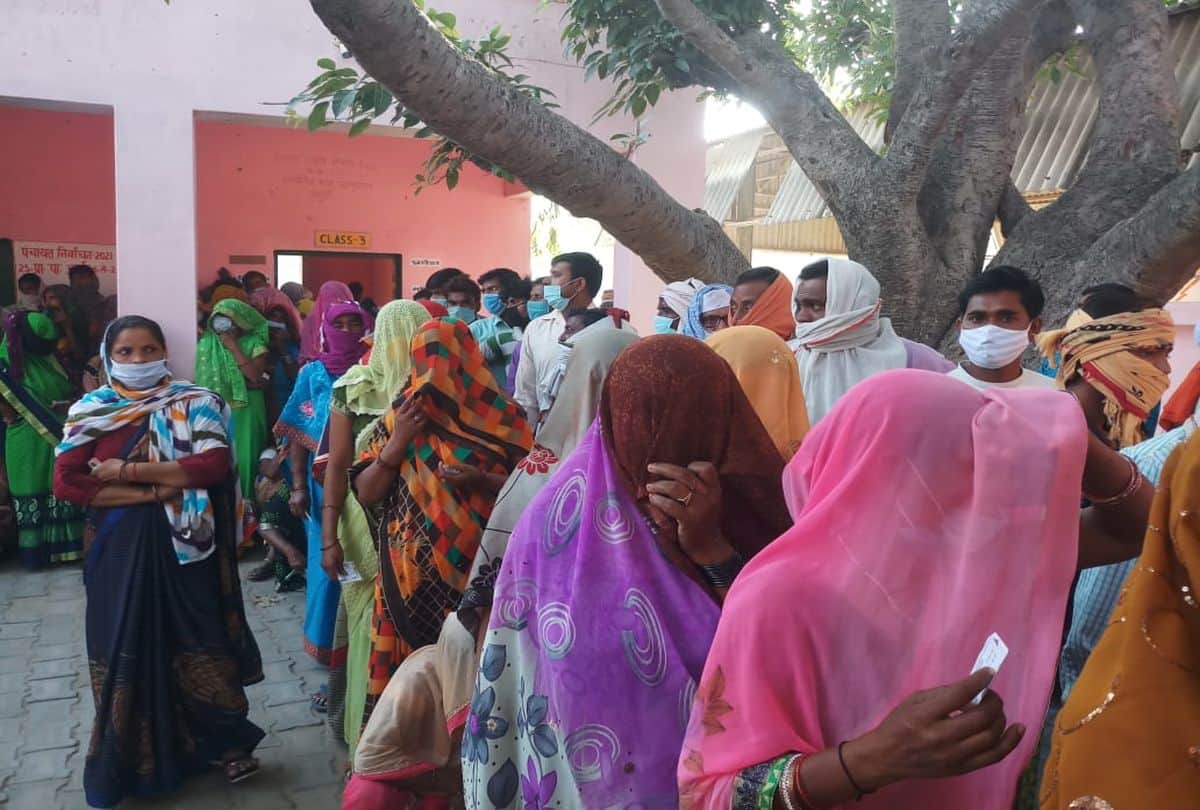 Voters queue outside polling booths as voting for panchayat elections is firozabad