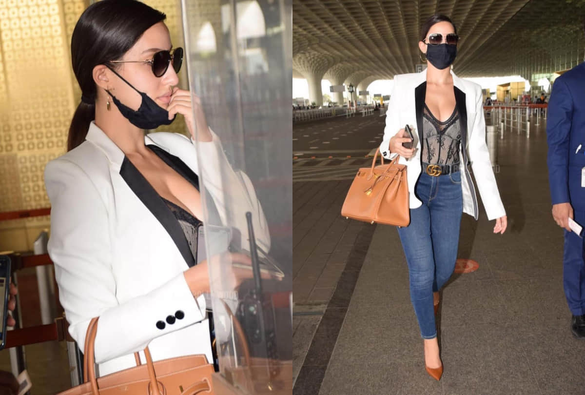 nora fatehi airport look in black corset top with white blazer and jeans