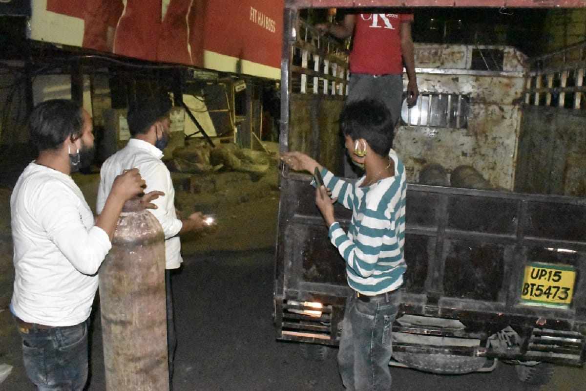 The oxygen plant at Bijauli in Meerut is crowded with family members and see photos