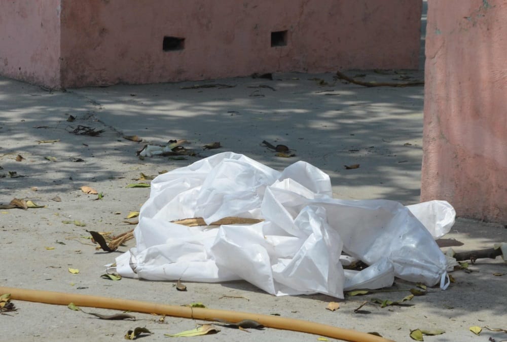 Coronavirus in Uttarakhand News: Covid Positive Dead body Funeral with PPE Kit and Throw in open area in Haridwar photos